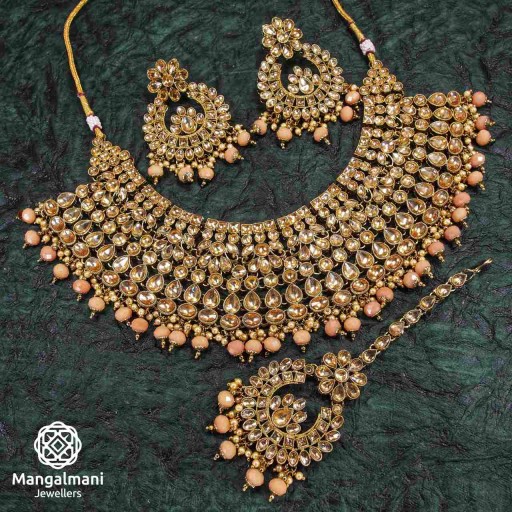 Ravishing Peach Coloured With Ethnic Work AD Kundan Necklace Set Adorned With AD Kundan