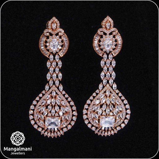 Charismatic White Coloured With Party Wear Designer Work CZ Earrings Embellished With Cubic Zirconia.