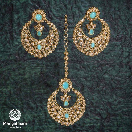 Pretty Sky Blue Coloured With Designer Stone Work Polki Earring And Tikka Set Studded With Reverse Ad