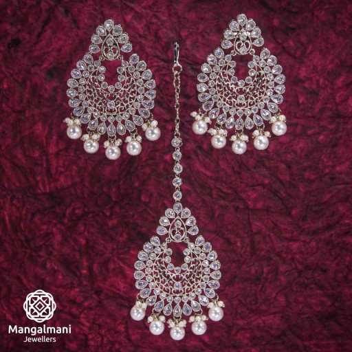Beautiful White Coloured With Ethnic Work Polki Earring And Tikka Set Adorned With Reverse Ad